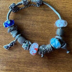 Elegant PANDORA Silver Charm Bracelet with Blue and Red Accents